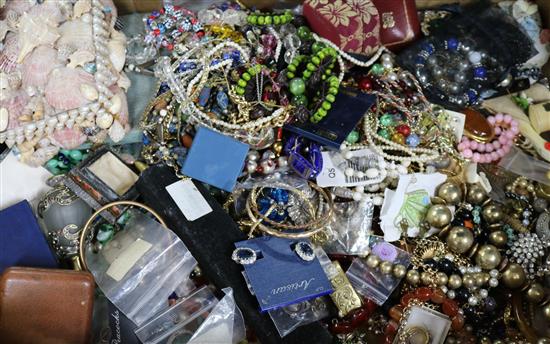 A large quantity of assorted costume jewellery including silver medallions and two lacquer boxes.